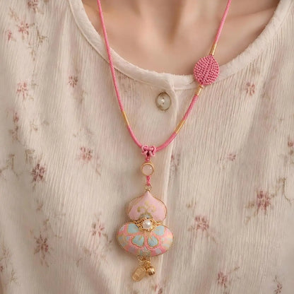 Pink Song Brocade gourd pendant shown from the front