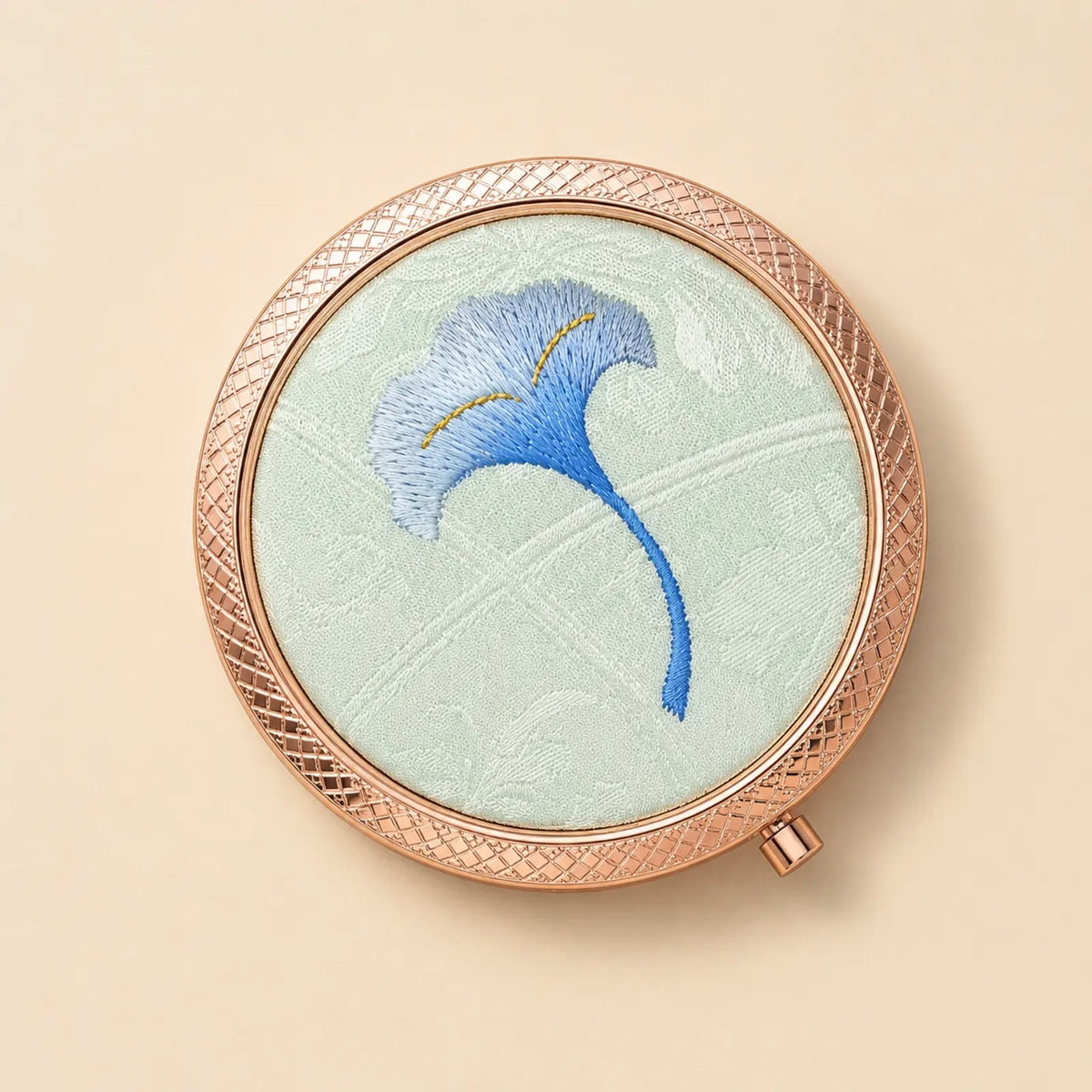 Top view of the Blue Ginkgo embroidered silk compact mirror