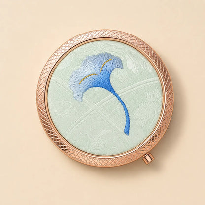 Top view of the Blue Ginkgo embroidered silk compact mirror