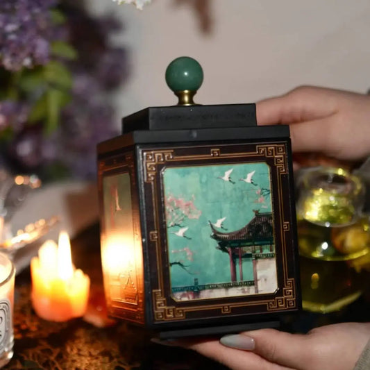 Green crane bamboo charcoal tea canister styled in an elegant tea room setting