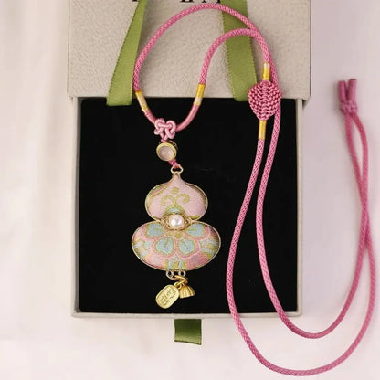 Pastel pink Song Brocade gourd pendant necklace presented in a gift box